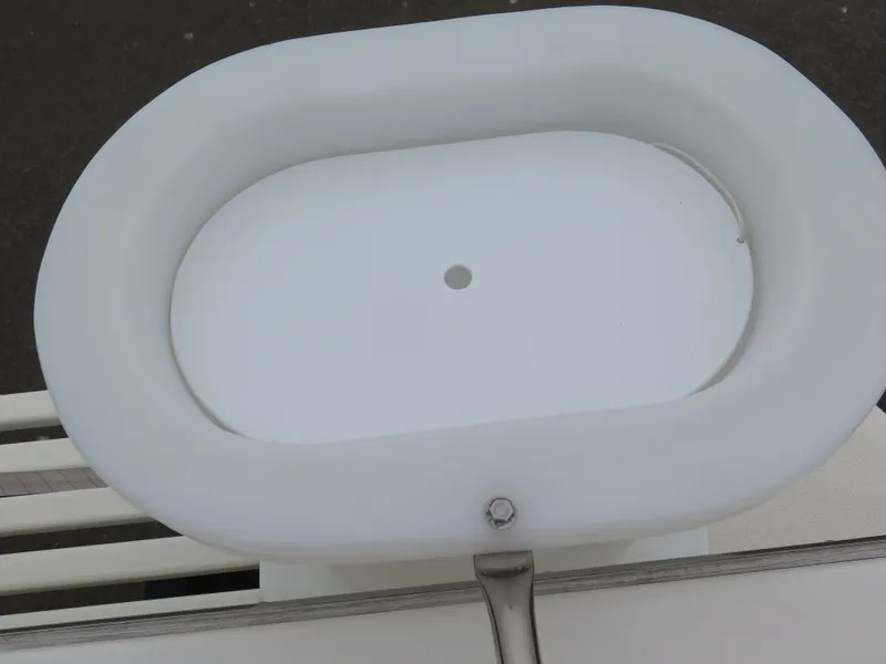 Slide: The Image of White oval sink on a 1988 Blackman 26 Billfisher boat. - 32