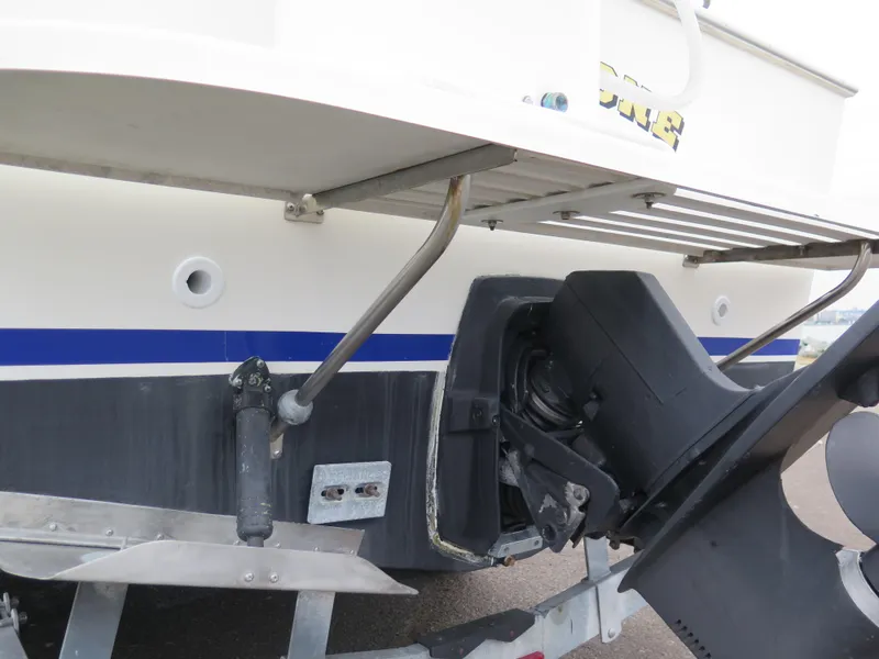 Slide: The Image of 1988 Blackman 26 Billfisher boat stern with outboard motor and trim tabs. - 4