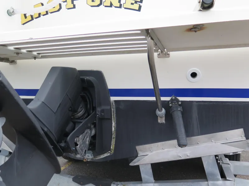 Slide: The Image of 1988 Blackman 26 Billfisher boat stern with outboard motor and ladder. - 5
