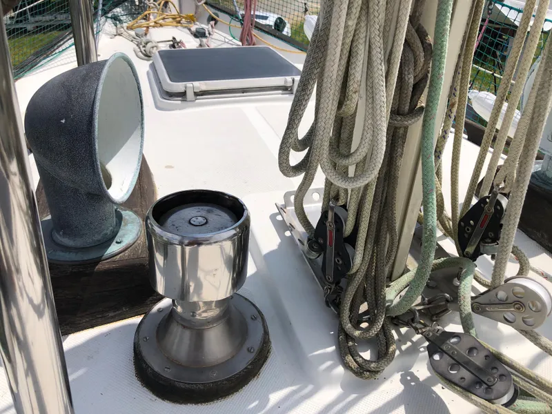 Slide: The Image of 1986 Pacific Seacraft Crealock 34 sailboat deck with winch and rigging details. - 12