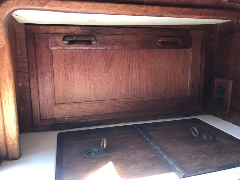 Slide: The Image of Wooden interior cabinetry of a 1986 Pacific Seacraft Crealock 34 sailboat. - 28