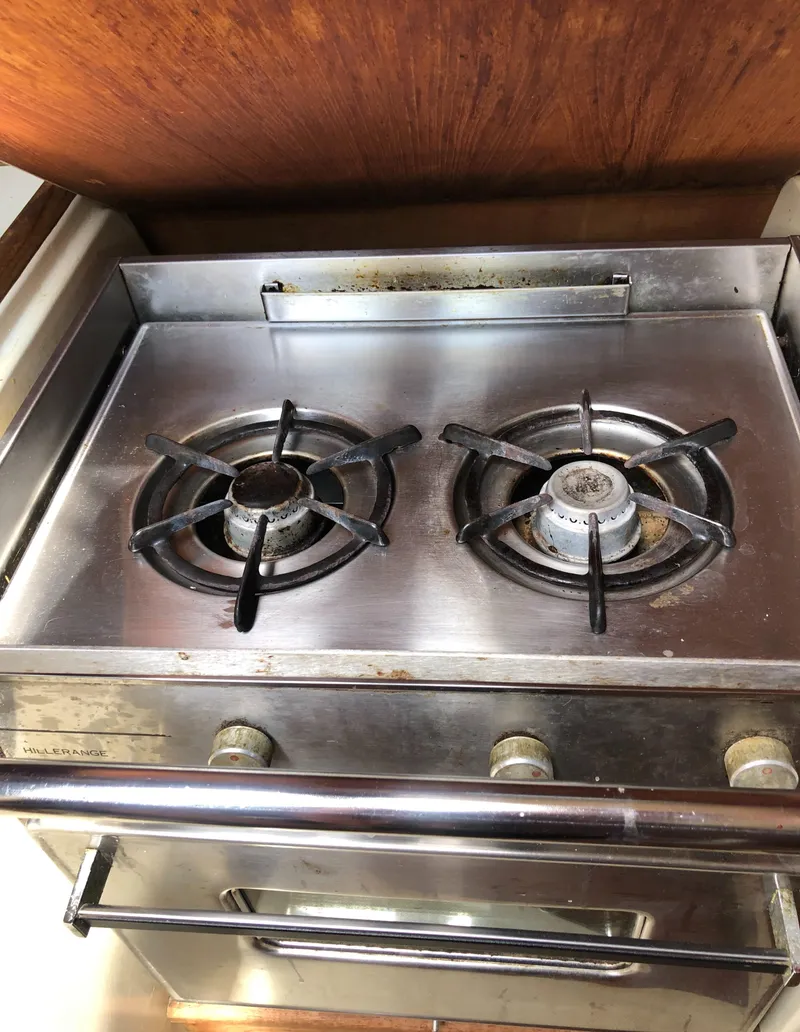 Slide: The Image of Stainless steel two-burner stove on 1986 Pacific Seacraft Crealock 34 yacht. - 32