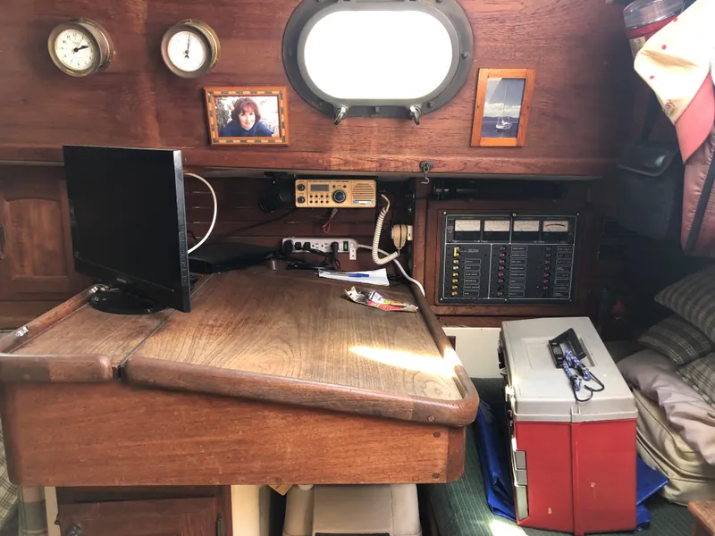 Slide: The Image of 1986 Pacific Seacraft Crealock 34 cabin interior with navigation desk and equipment. - 39
