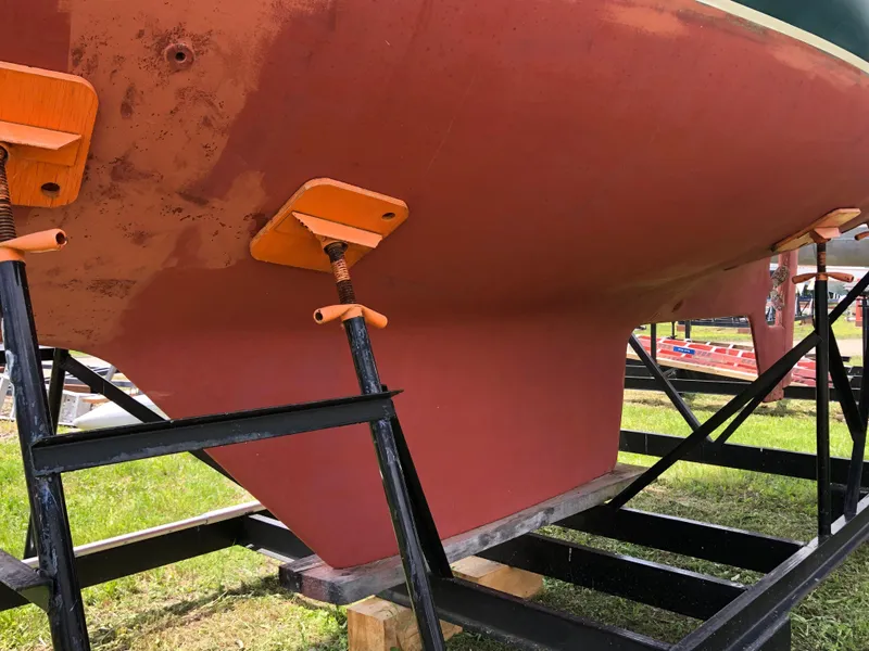 Slide: The Image of 1986 Pacific Seacraft Crealock 34 sailboat hull on stands, ready for maintenance. - 4
