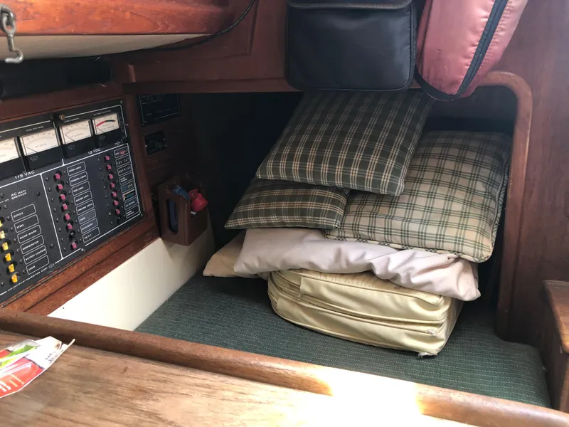 Slide: The Image of Interior of 1986 Pacific Seacraft Crealock 34 with cushions and control panel. - 40