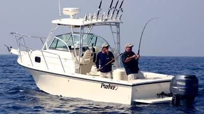 Slide: The Image of 2006 Parker 2310 Walkaround boat with anglers fishing in open sea. - 12