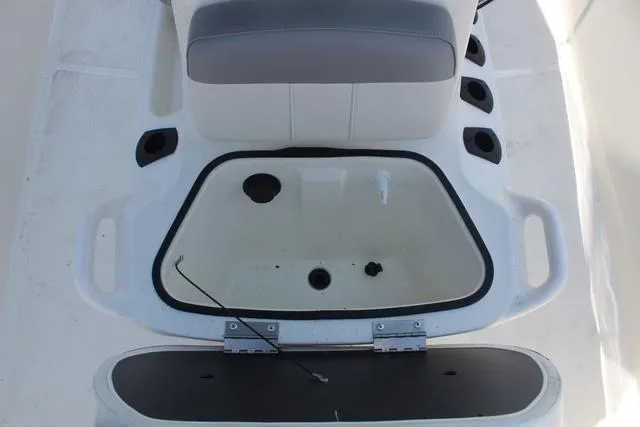 Slide: The Image of Interior view of 2021 Mako Pro Skiff 15 CC with storage compartment. - 15