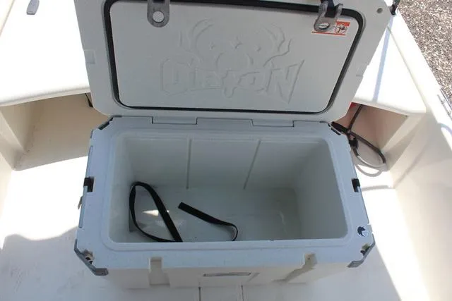 Slide: The Image of Open cooler on a 2021 Mako Pro Skiff 15 CC boat. - 16