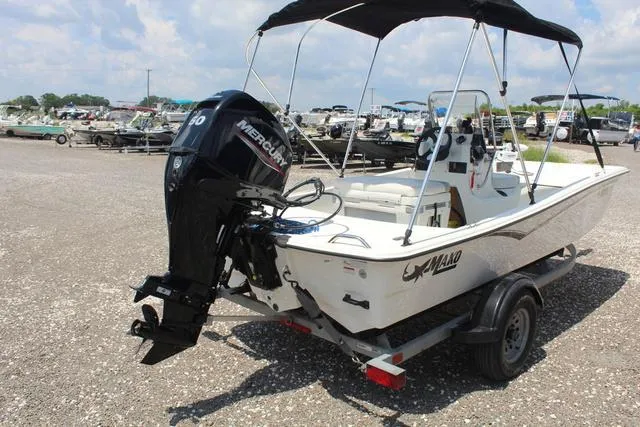 Slide: The Image of 2021 Mako Pro Skiff 15 CC with Mercury engine on trailer. - 5
