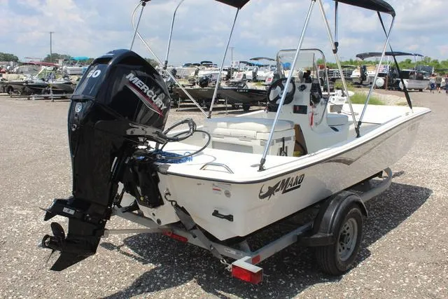 Slide: The Image of 2021 Mako Pro Skiff 15 CC boat on trailer, exterior view. - 6