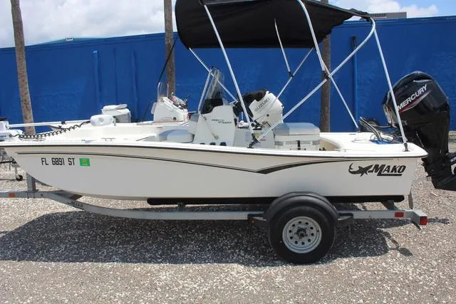 Slide: The Image of 2021 Mako Pro Skiff 15 CC boat on trailer, side view. - 9