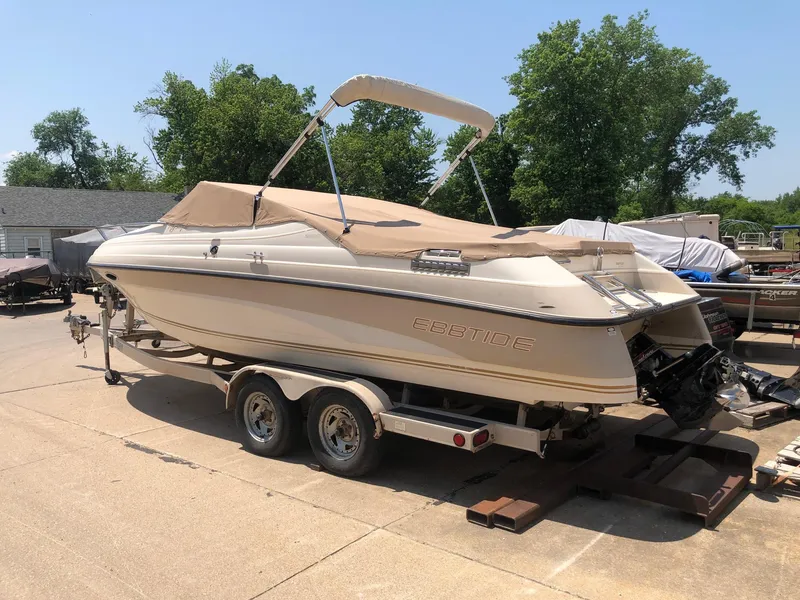 Slide: The Image of 1997 Ebbtide 2300 Cuddy boat on trailer, parked outdoors, sunny day. - 4