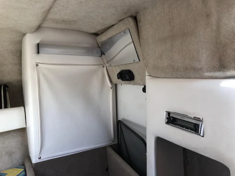Slide: The Image of Interior of 1997 Ebbtide 2300 Cuddy cabin with storage compartments. - 5