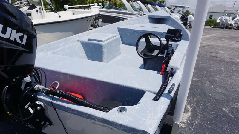 Slide: The Image of 2023 Griffis Fiberglass 16 Wide Side Console boat with Suzuki outboard motor. - 5