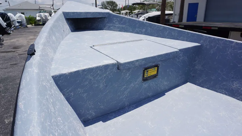 Slide: The Image of 2023 Griffis Fiberglass 16 Wide Side Console boat interior, showcasing storage compartment and sleek design. - 7