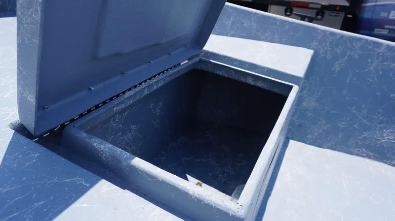 Slide: The Image of Open storage compartment of 2023 Griffis Fiberglass 16 Wide Side Console boat. - 8