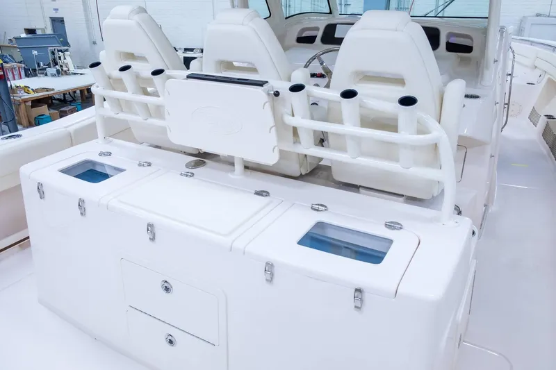 Slide: The Image of 2024 Grady-White Canyon 386 boat interior with seating and storage compartments. - 10