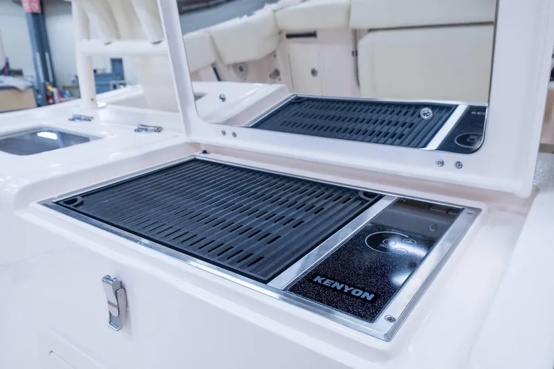 Slide: The Image of Grady-White Canyon 386 2024 boat with Kenyon grill in cockpit area. - 11