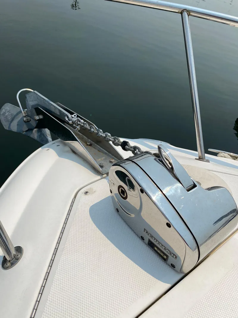Slide: The Image of 2008 Sea Ray 240 Sundancer anchor system on calm water. - 13