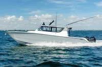 The Image of 2023 Invincible 46' Catamaran Pilothouse cruising on open water. - 1