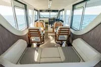 Slide: The Image of Interior of 2023 Invincible 46' Catamaran Pilothouse with seating and ocean view. - 5