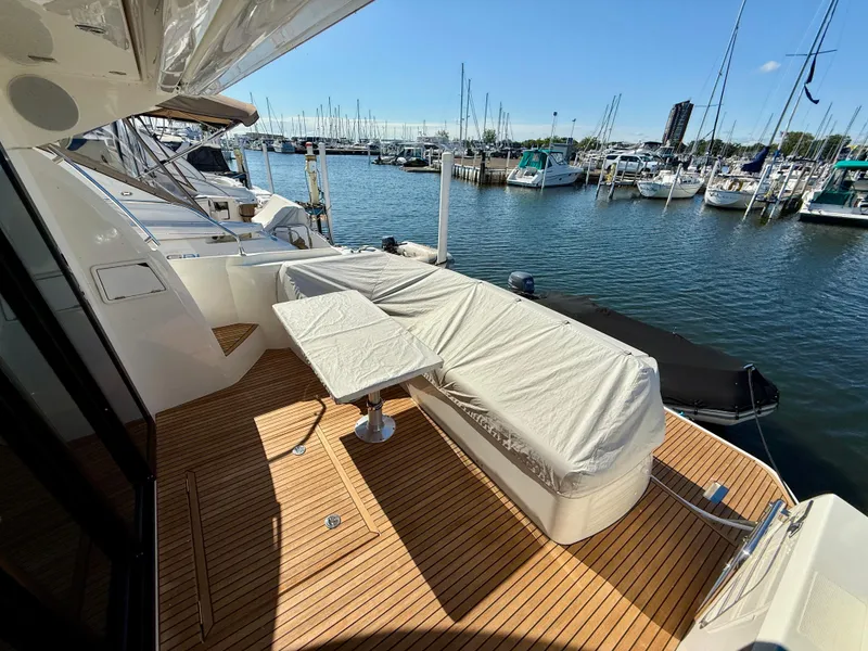 Slide: The Image of Luxury yacht deck of 2020 Prestige 420S, docked at marina with clear skies. - 10