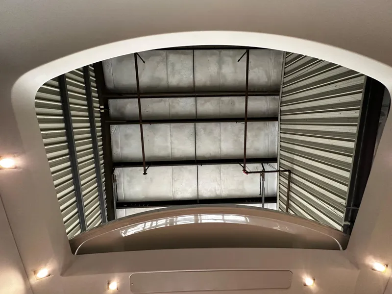 Slide: The Image of Interior view of a 2020 Prestige 420S yacht, showcasing the sunroof and ceiling details. - 18