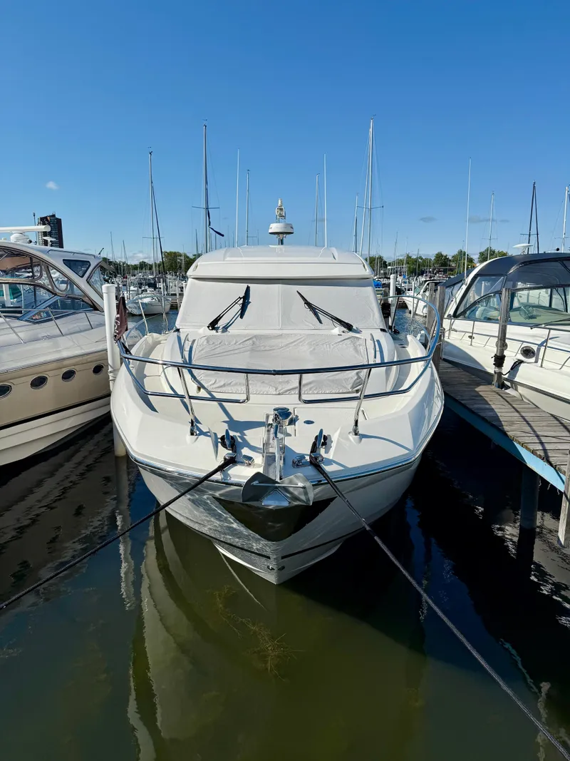 Slide: The Image of Luxury 2020 Prestige 420S yacht docked in marina under clear blue sky. - 2