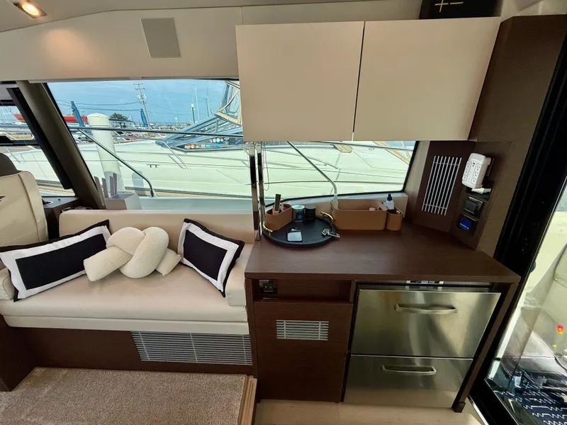 Slide: The Image of Luxurious interior of 2020 Prestige 420S yacht with modern seating and cabinetry. - 21