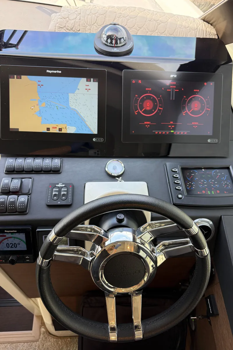 Slide: The Image of Cockpit of 2020 Prestige 420S yacht with navigation screens and steering wheel. - 23