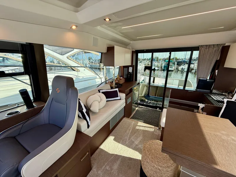 Slide: The Image of Luxurious interior of a 2020 Prestige 420S yacht with modern seating and marina view. - 27
