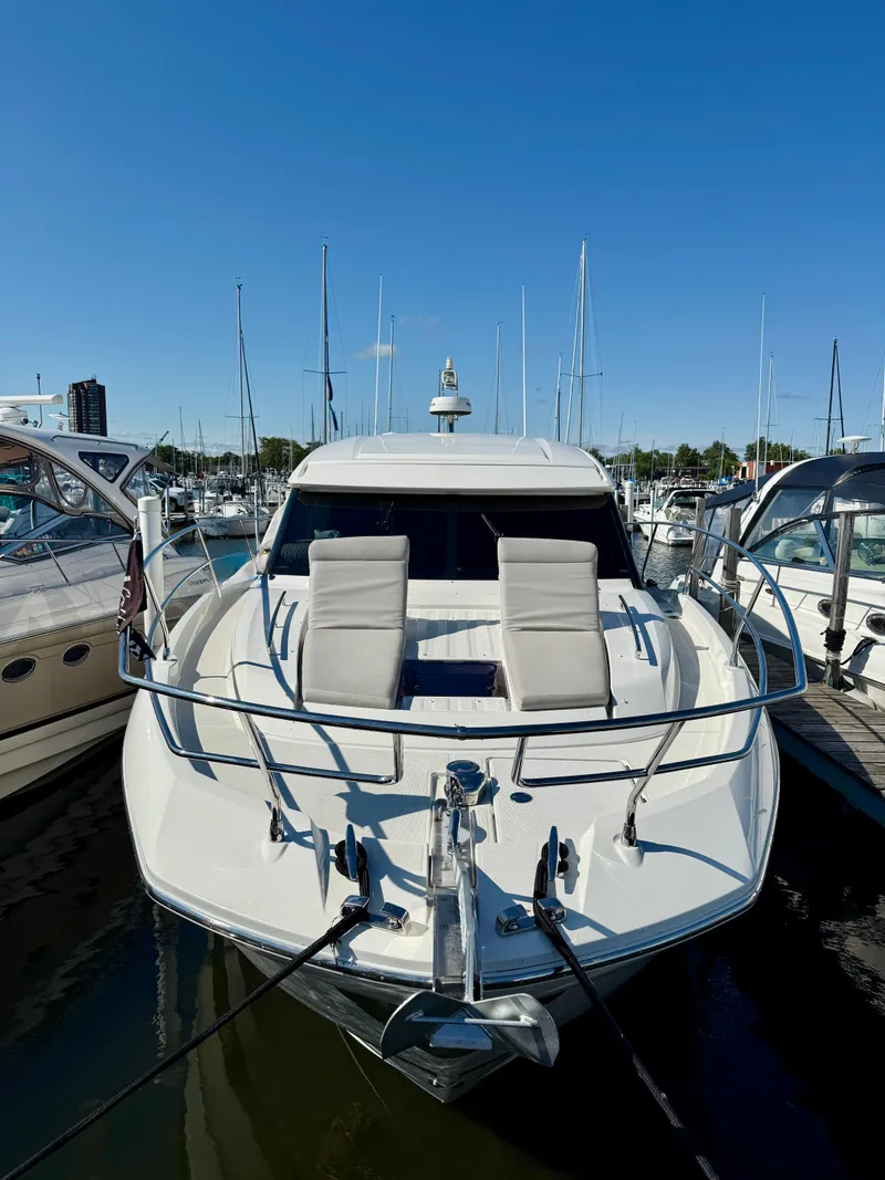Slide: The Image of 2020 Prestige 420S yacht docked at marina under clear blue sky. - 3
