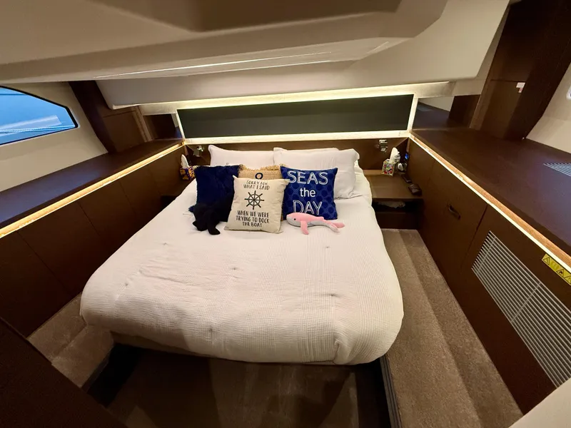 Slide: The Image of Luxurious bedroom in 2020 Prestige 420S yacht with cozy bedding and decorative pillows. - 31