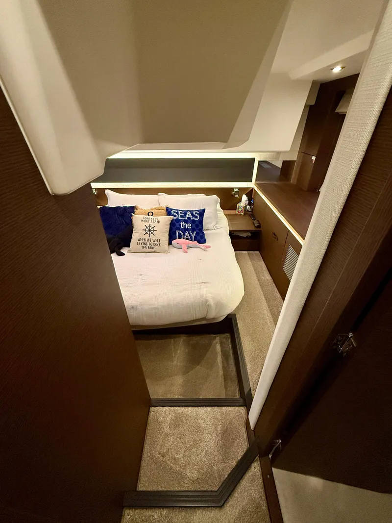 Slide: The Image of Luxurious cabin interior of a 2020 Prestige 420S yacht with cozy bedding and nautical decor. - 32