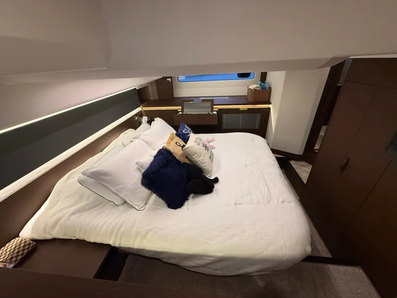 Slide: The Image of Luxurious bedroom interior of 2020 Prestige 420S yacht with cozy bedding and modern design. - 33