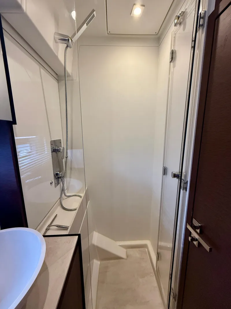 Slide: The Image of Modern bathroom interior in 2020 Prestige 420S yacht, featuring sleek shower and basin. - 35