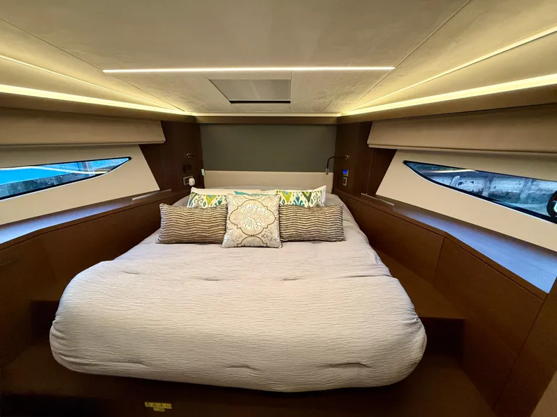 Slide: The Image of Luxurious bedroom interior of 2020 Prestige 420S yacht with modern design and ambient lighting. - 37