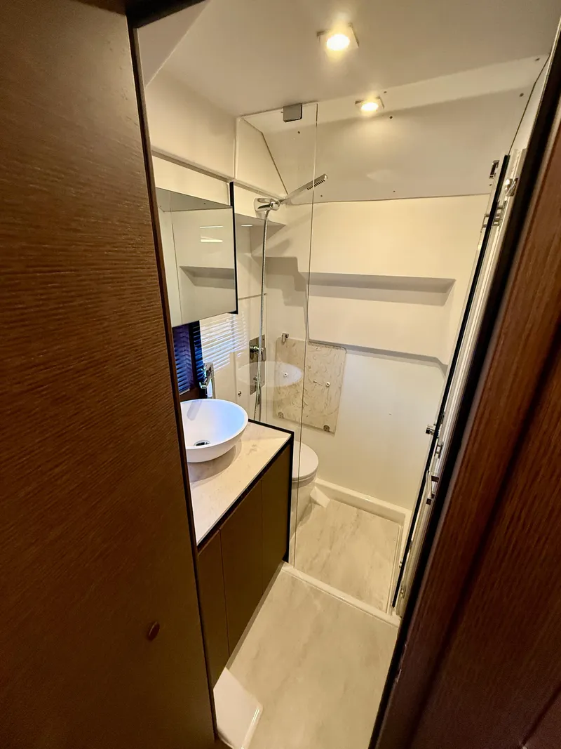 Slide: The Image of Modern bathroom in 2020 Prestige 420S yacht with glass shower and vessel sink. - 39