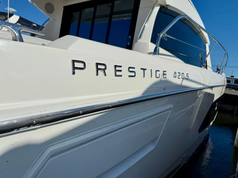 Slide: The Image of 2020 Prestige 420S yacht side view with sleek design and chrome lettering. - 4
