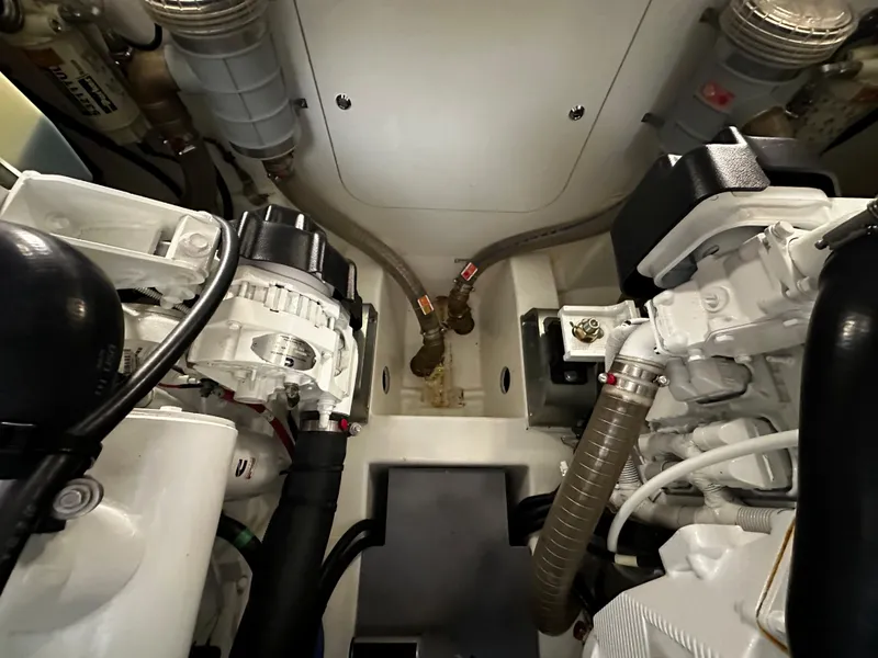 Slide: The Image of Engine room of a 2020 Prestige 420S yacht, showcasing mechanical components and piping. - 41