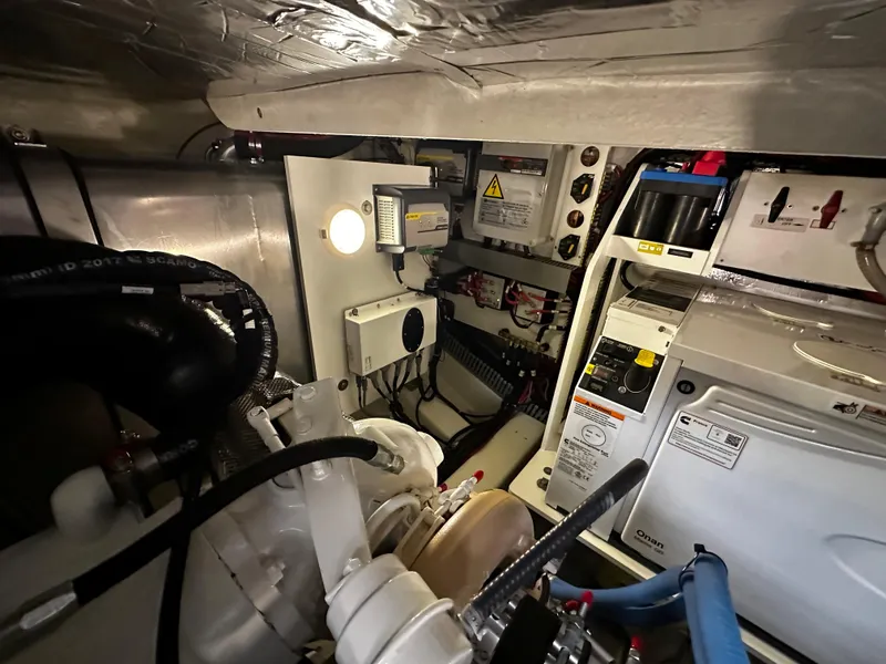 Slide: The Image of Engine room of a 2020 Prestige 420S yacht, showcasing mechanical components and electrical systems. - 43