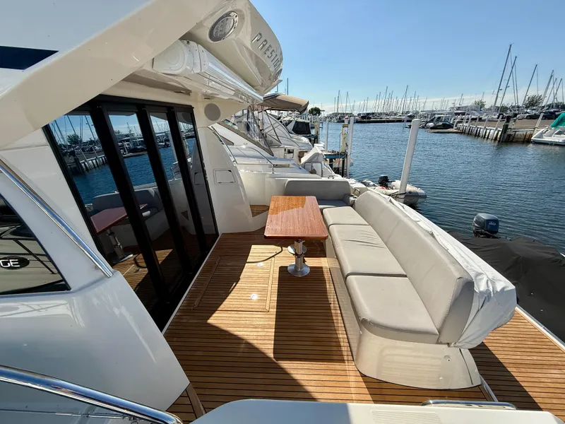 Slide: The Image of Luxury yacht Prestige 420S 2020 model with spacious deck and marina view. - 9