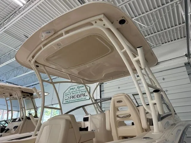Slide: The Image of 2024 Grady-White Freedom 235 boat with T-top in showroom. - 12
