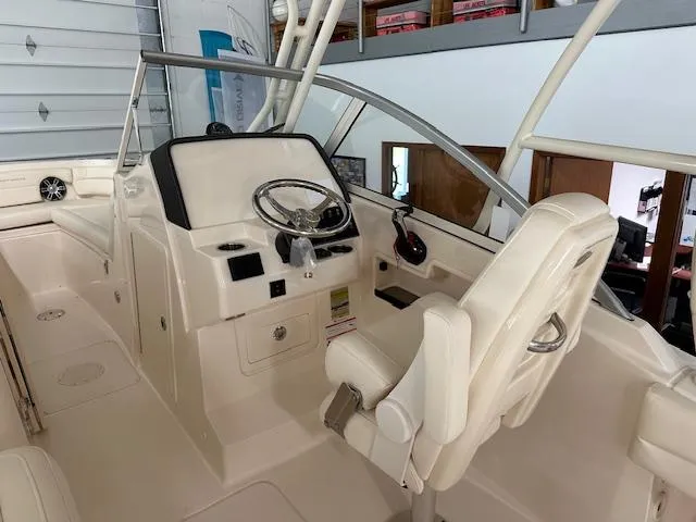 Slide: The Image of 2024 Grady-White Freedom 235 boat interior with helm station and seating. - 3