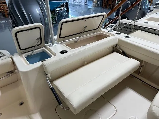 Slide: The Image of 2024 Grady-White Freedom 235 boat interior with storage compartments and seating. - 8