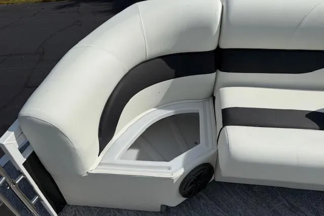 Slide: The Image of 2023 JC Neptoon 23 TT Sport boat interior with white and black cushioned seating. - 20