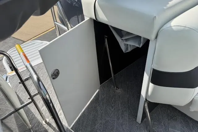 Slide: The Image of 2023 JC Neptoon 23 TT Sport boat interior with open storage compartment. - 25