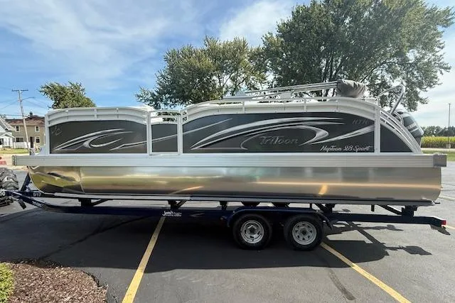 Slide: The Image of 2023 JC Neptoon 23 TT Sport pontoon boat on trailer, parked outdoors. - 5