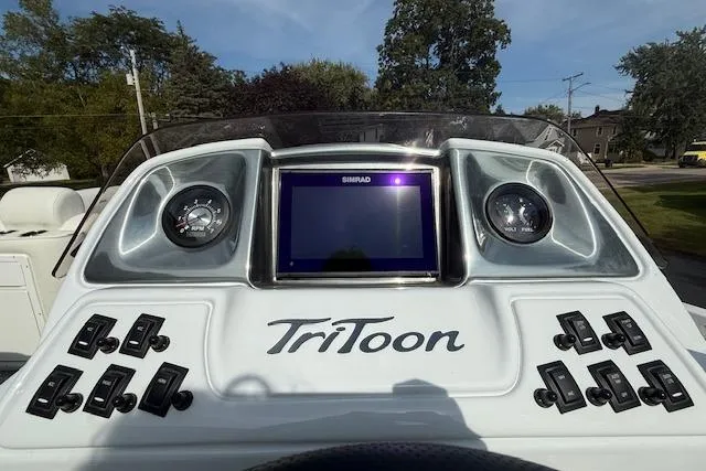 Slide: The Image of 2023 JC Neptoon 23 TT Sport dashboard with controls and display screen. - 10