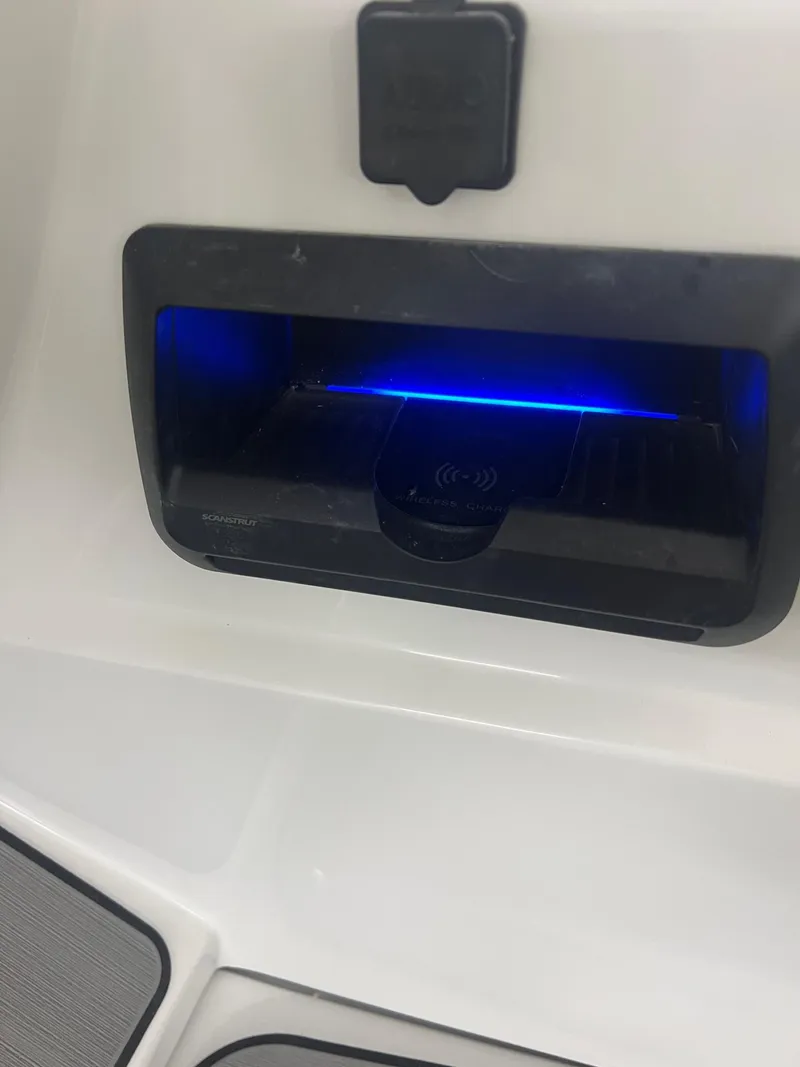 Slide: The Image of Charging station with blue LED light on a 2023 JC Neptoon 23 TT Sport boat. - 12